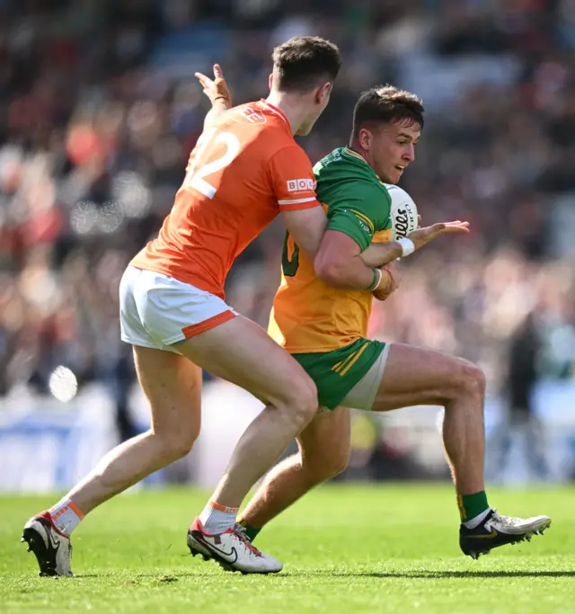 Peadar Mogan of Donegal in action against Joe McElroy of Armagh