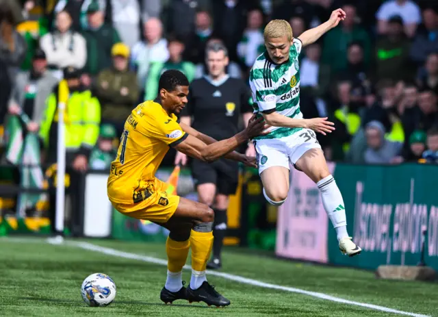 Livingston's Michael Nottingham closes down Celtic's Daizen Maeda