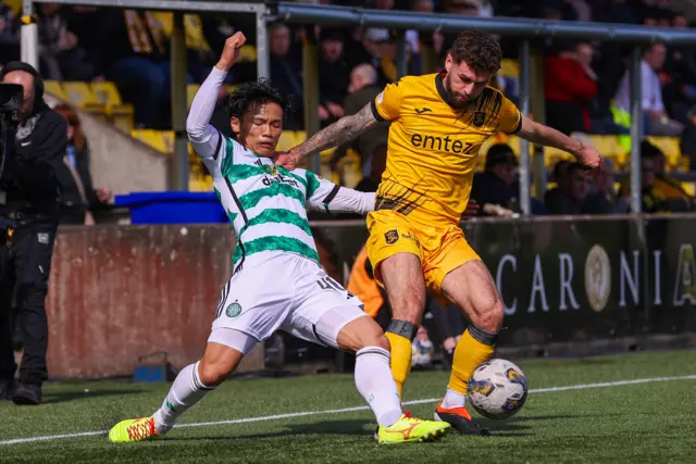 Celtic midfielder Reo Hatate and Livingston midfielder Jamie Brandon