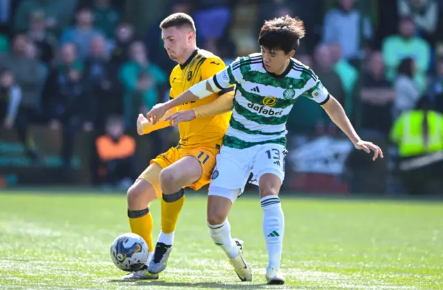 Livingston's Daniel MacKay and Celtic's Yang Hyun-jun