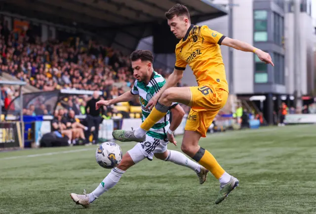 Celtic winger Nicolas Kuhn and Livingston winger Steven Bradley