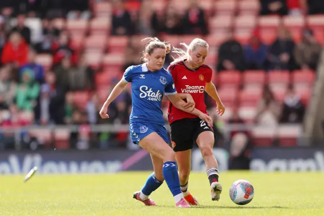 Payne and Turner duel for the ball