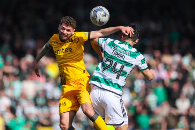 Livingston's Jamie Brandon and Celtic's Tomoki Iwata