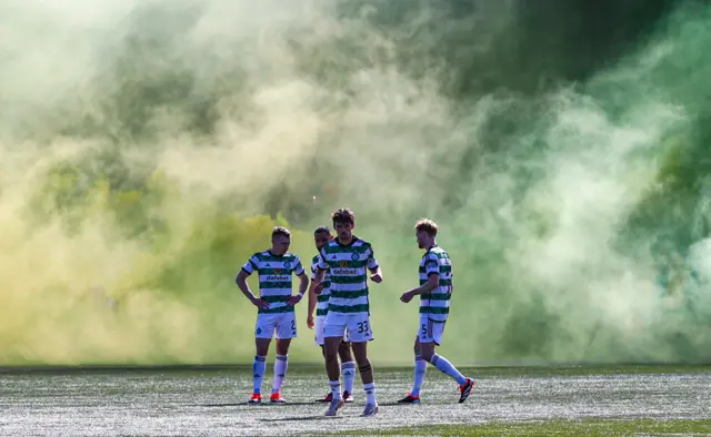 Celtic players in smoke