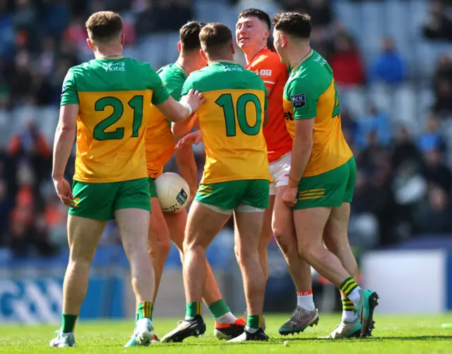 Phillip Doherty, Michael Langan, Peadar Mogan and Caolan McColgan have words with Oisin Conaty after they won a turnover