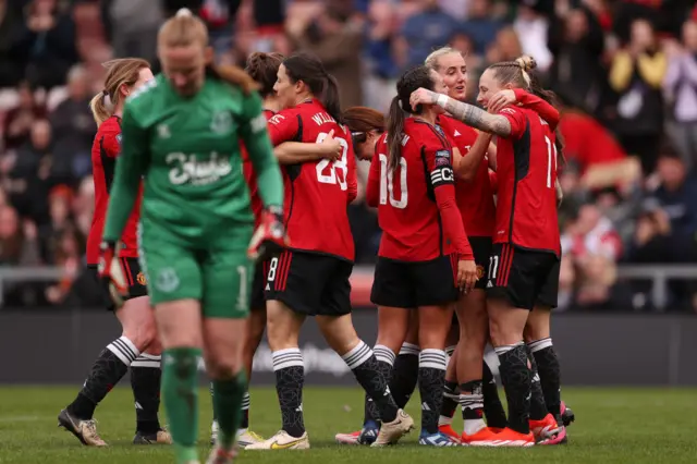 Brosnan walks back to her goal as Utd celebrate