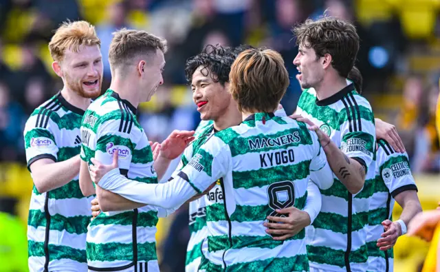 Celtic players celebrate their opening goal