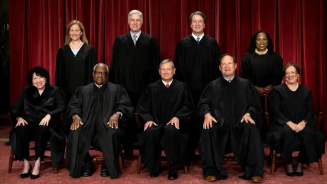 U.S. Supreme Court justices Amy Coney Barrett, Neil M. Gorsuch, Brett M. Kavanaugh, Ketanji Brown Jackson, Sonia Sotomayor, Clarence Thomas, Chief Justice John G. Roberts, Jr., Samuel A. Alito, Jr. and Elena Kagan pose for their group portrait at the Supreme Court in Washington, U.S., October 7, 2022