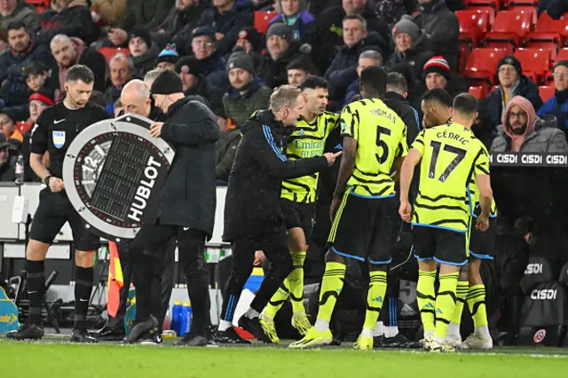 Gabriel Martinelli of Arsenal is helped off the pitch