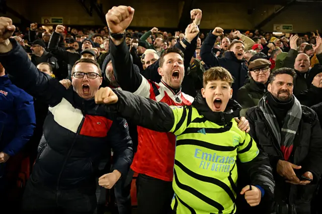 Arsenal fans celebrate after their sides second goal