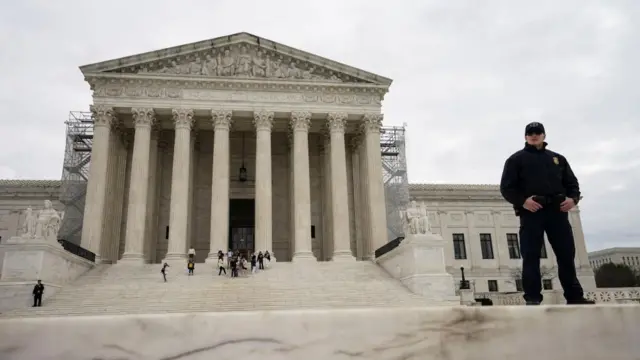 A Supreme Court police officer stands outside the United States Supreme Court building after justices unanimously reversed a Dec. 19, 2023 decision by Colorado's top court to kick Donald Trump off the state's Republican primary ballot, in Washington, U.S., March 4, 2024.