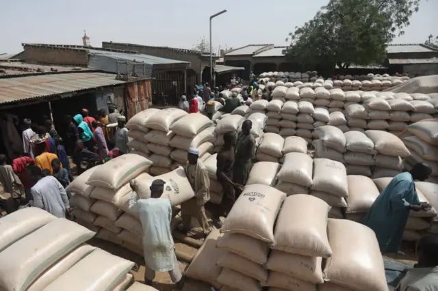 Bags of maize are arraninged at a warehouse in the market in Jibia on February 18, 2024.