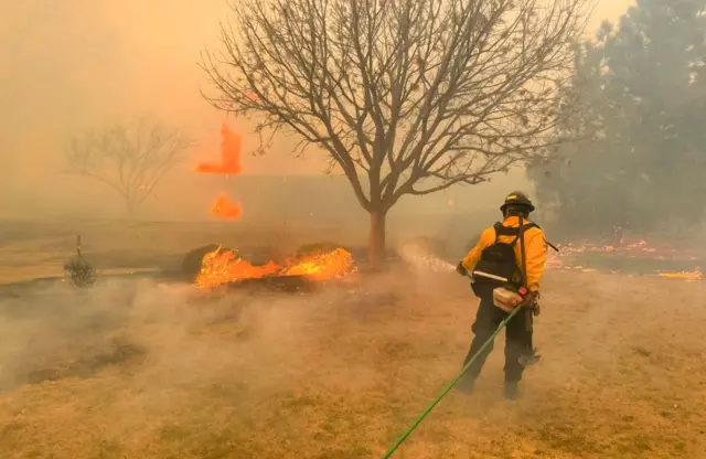 Flower Mound Fire Department firefighters helping to contain a wildfire in the panhandle region of Texas