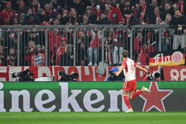 Kane celebrates his second goal v Lazio in front of the home fans.