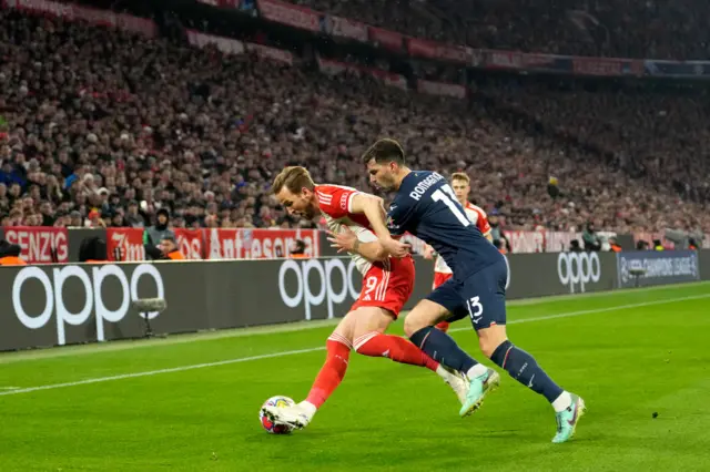 Kane is shepherded to the touchline by romagnoli.