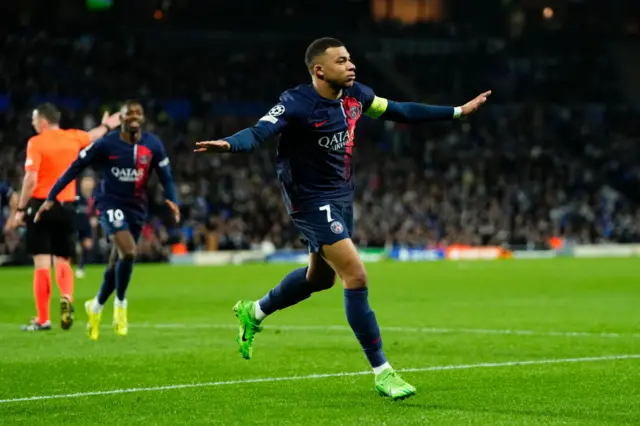 Mbappe celebrates his goal by doing a plane celebration.