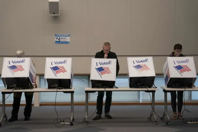 Voters cast their ballots during the first day of early voting at a polling station in Mount Pleasant, South Carolina, US