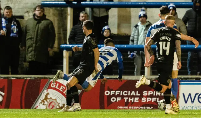 Morton's Michael Garrity collides with Dundee United's Jordan Tillson during a cinch Championship match between Greenock Morton and Dundee United