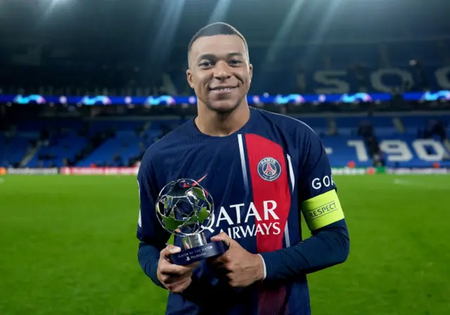 Mbappe poses with the MOTM trophy post win at La Real.