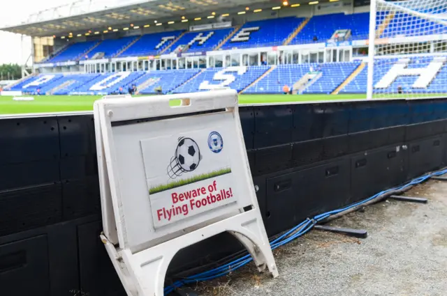 Beware of flying footballs sign at London Road, Peterborough