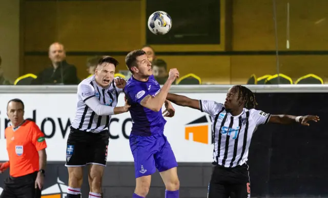 Airdrie's Nikolay Todorov and Dunfermline's (L-R) Josh Edwards and Ewan Otoo compete for the ball in the air during a cinch Championship match between Dunfermline and Airdrieonians