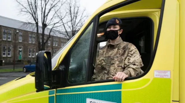 Member of the military with ambulance in Cardiff, December 2020