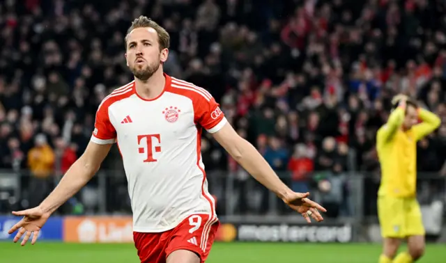 Kane celebrates opening the scoring for Bayern.