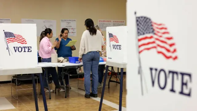 Poll workers take their oaths at the Cameron County Courthouse polling place