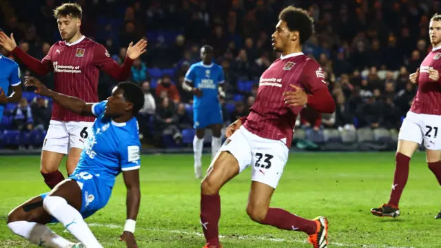 Peterborough United midfielder Ephron Mason-Clark (10) slides in to equalise during the EFL Sky Bet League 1 match between Peterborough United and Northampton Town