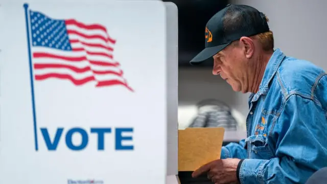 A voter fills out his ballot at the Fairfax County Government Center polling place in Fairfax, Virginia, USA, 05 March 2024.