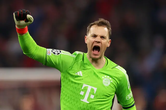 Neuer fist pumps and shouts in delight as his side take the lead.