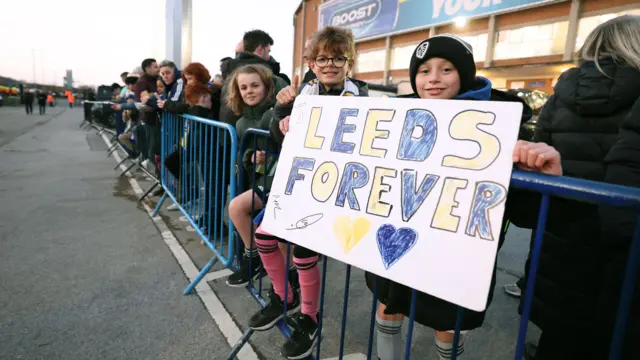 Leeds fans hold up sign