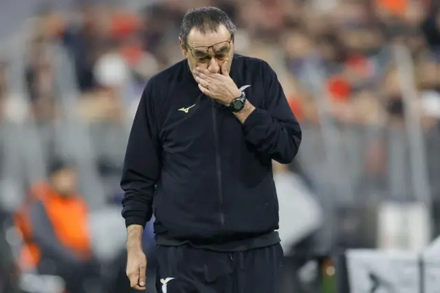 Sarri wipes his eyes on the touchline.