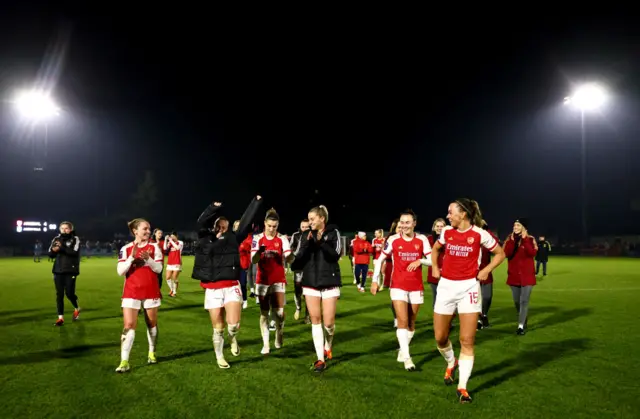 Arsenal players applaud the fans at Meadow Park at full time.