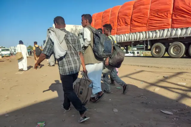 Displaced people fleeing from Wad Madani in Sudan's Jazira state arrive in Gedaref in the country's east on December 19, 2023.