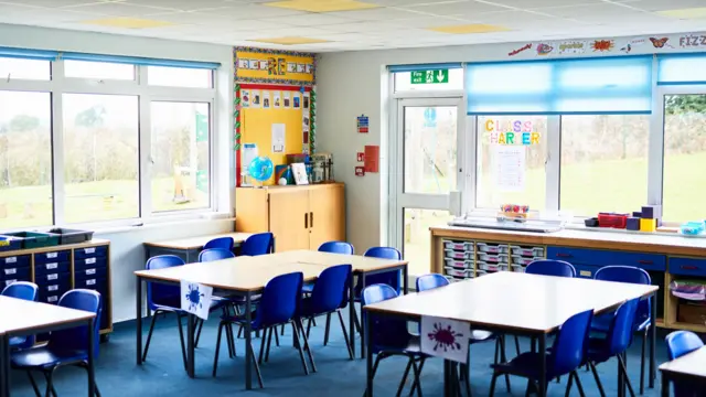 Tidy tables and chairs arranged in school class room