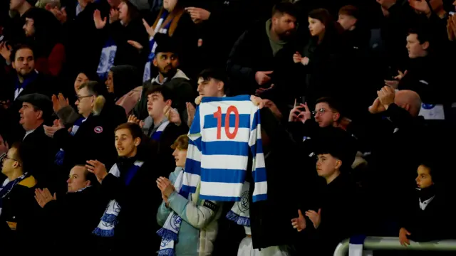 QPR fan holds up number 10 shirt