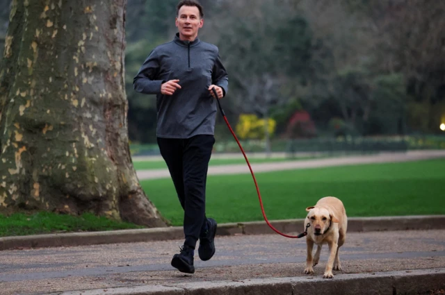 Jeremy Hunt and Poppy the labrador go for a run around St James' Park