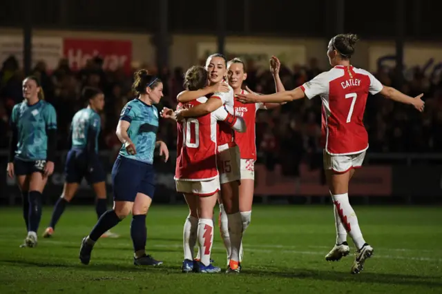 Arsenal players celebrate with Alessia Russo after her goal v London City.