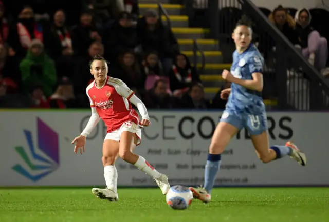 Caitlin Foord fires a cross into the box.