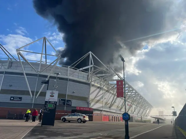 Smoke billows over Southampton's St Mary's Stadium