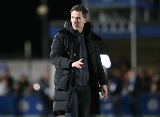 Gareth Taylor walks across the Kingsmeadow pitch.