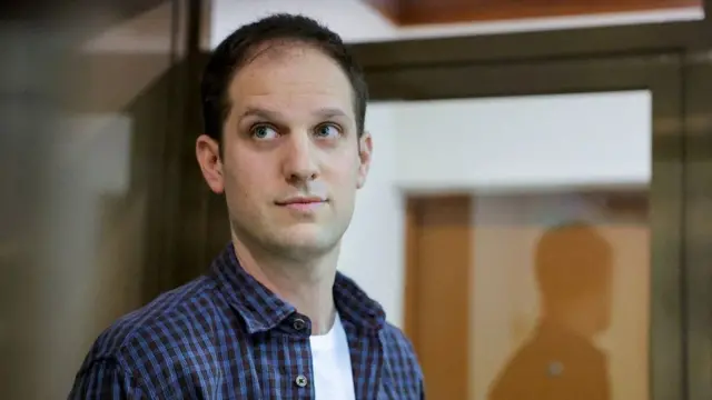 A man standing in front of a door