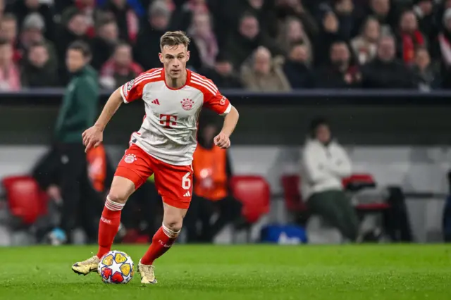 Joshua Kimmich runs with the ball