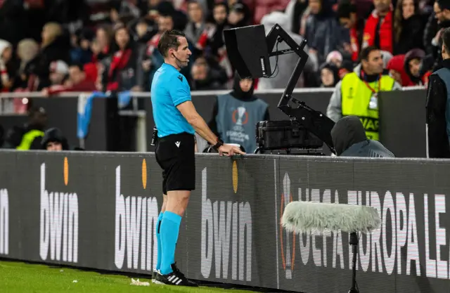 Referee at monitor