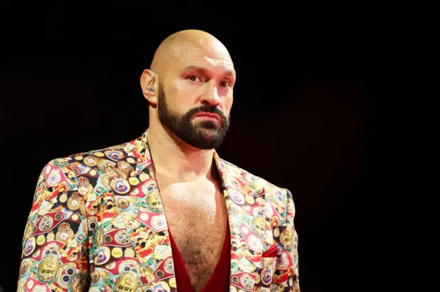 Tyson Fury in suit and red vest