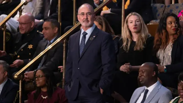 Fain seen looking out into the crowd before Biden's speech began