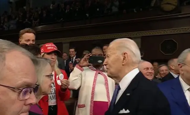 The congresswoman was seen calling for Biden's attention