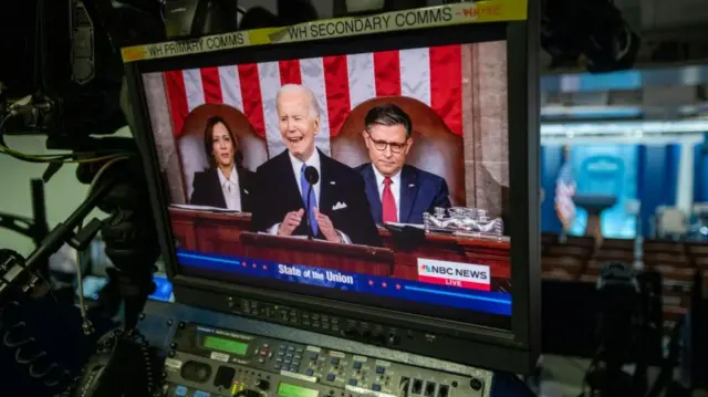 Biden seen through a TV monitor