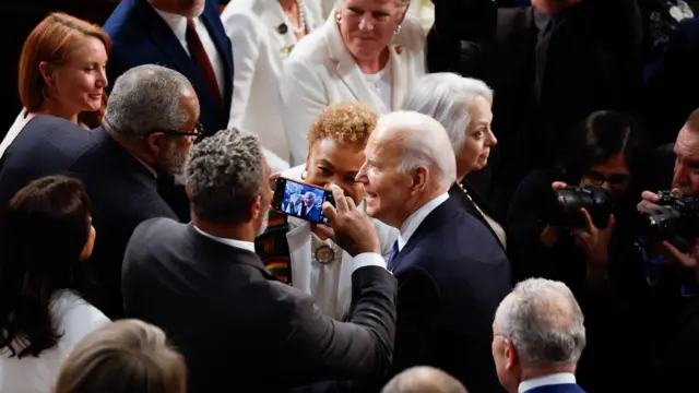 Joe Biden taking a selfie with a perso